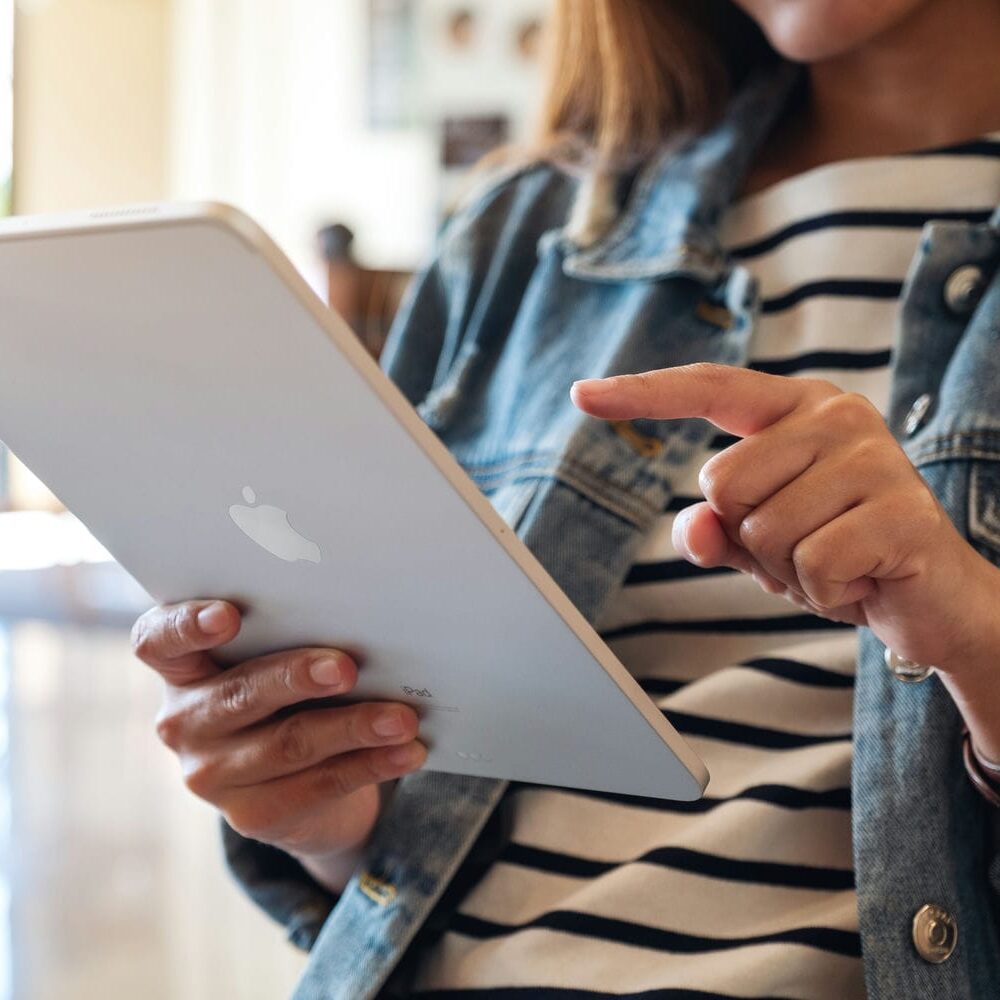 woman looking at ipad